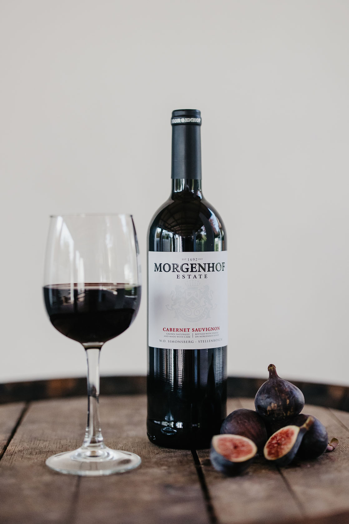 Morgenhof Estate Cabernet Sauvignon with a glass of red wine and fresh figs